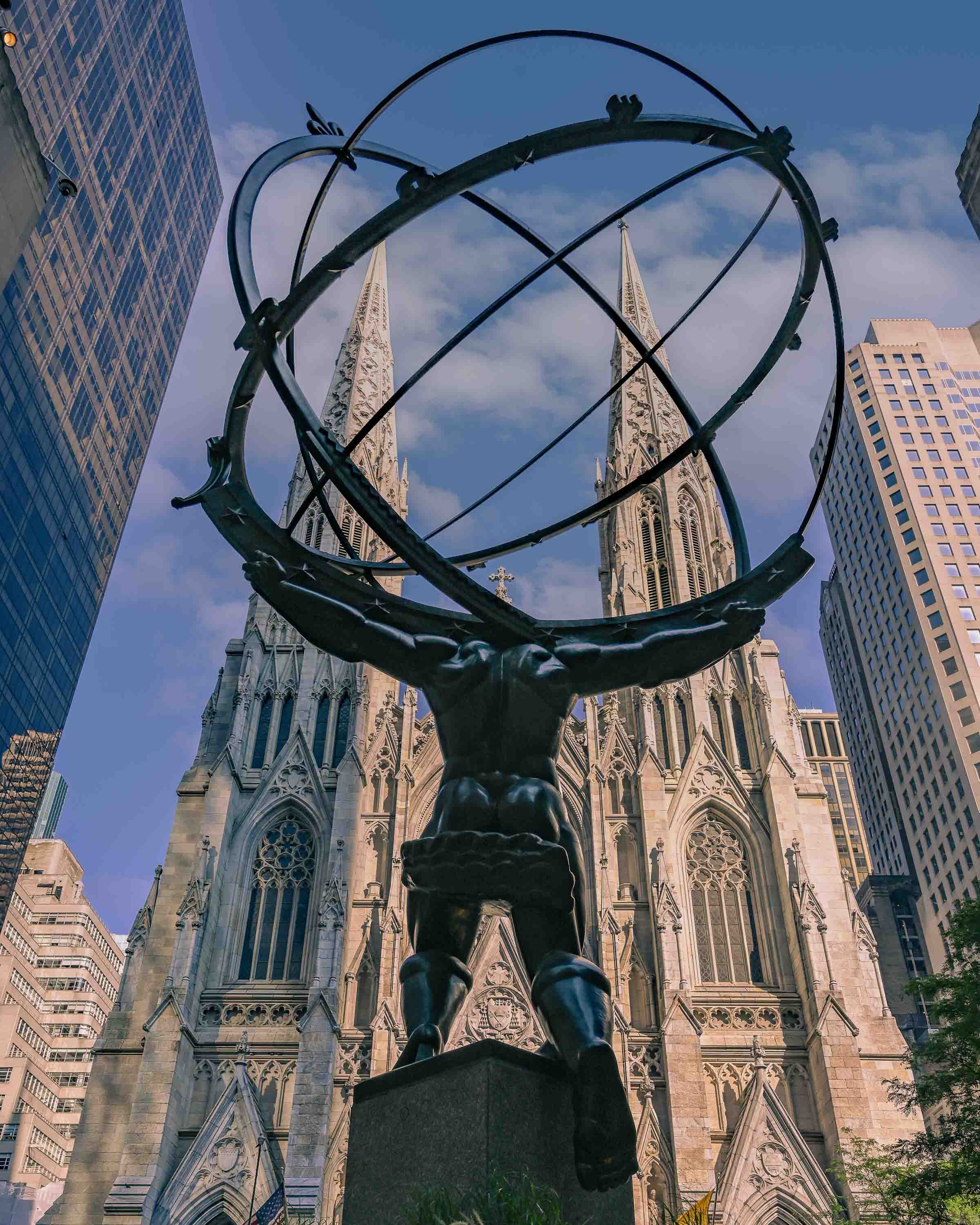 Atlas and, in the background, the towers of St. Patrick's Cathedral.