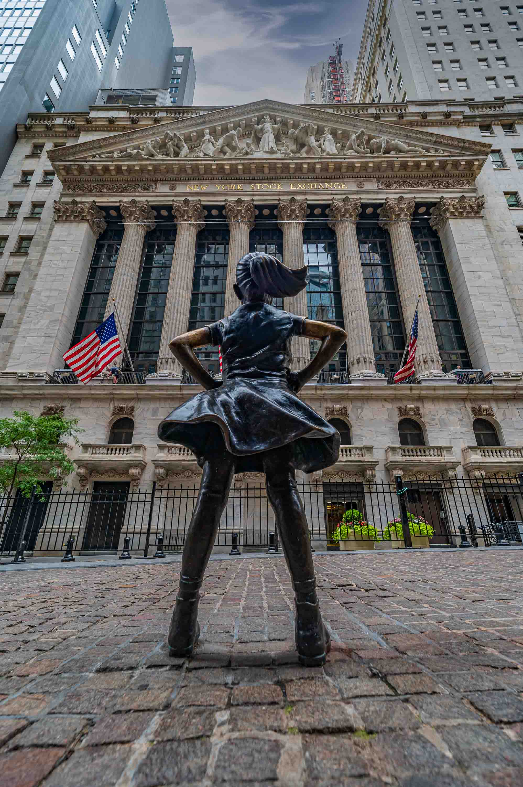 The Fearless Girl, facing the New York Stock Exchange building.