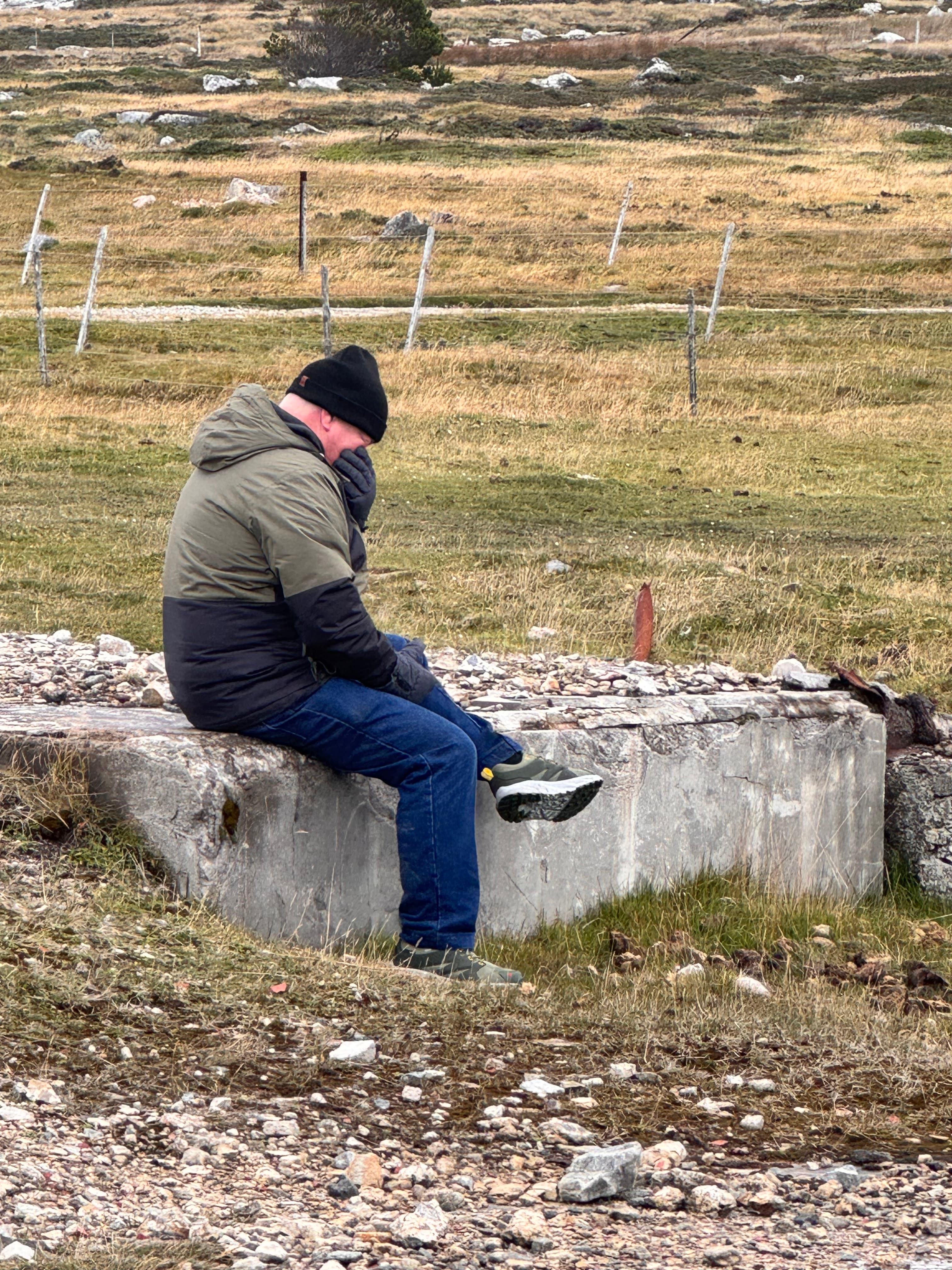 Rodrigo, in silence, among the ruins of the former Royal Marines barracks at Moody Brook.